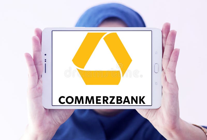 Logo of Commerzbank on samsung tablet holded by arab muslim woman. Commerzbank AG is a global banking and financial services company based in germany. Logo of Commerzbank on samsung tablet holded by arab muslim woman. Commerzbank AG is a global banking and financial services company based in germany