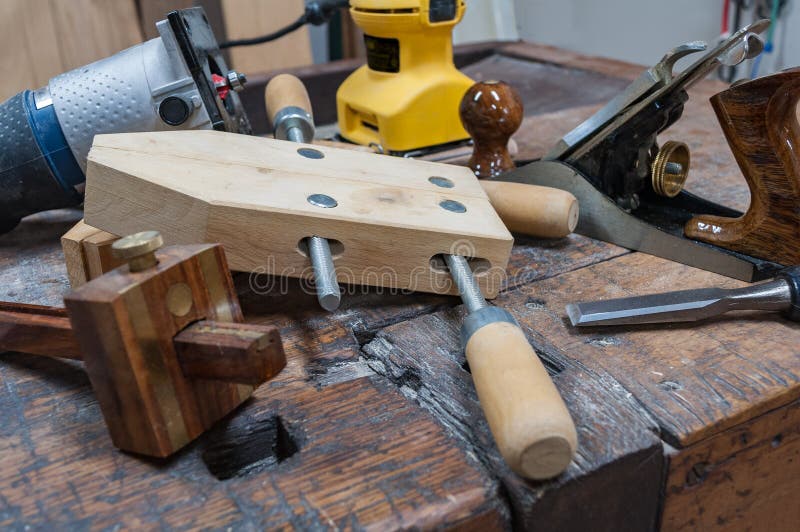 Assortment of woodworking tools on an antique workbench stock photo Assortment of woodworking tools on an antique workbench stock photo