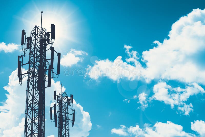 Communication tower or 3G 4G network telephone cellsite silhouette on blue sky and space for text