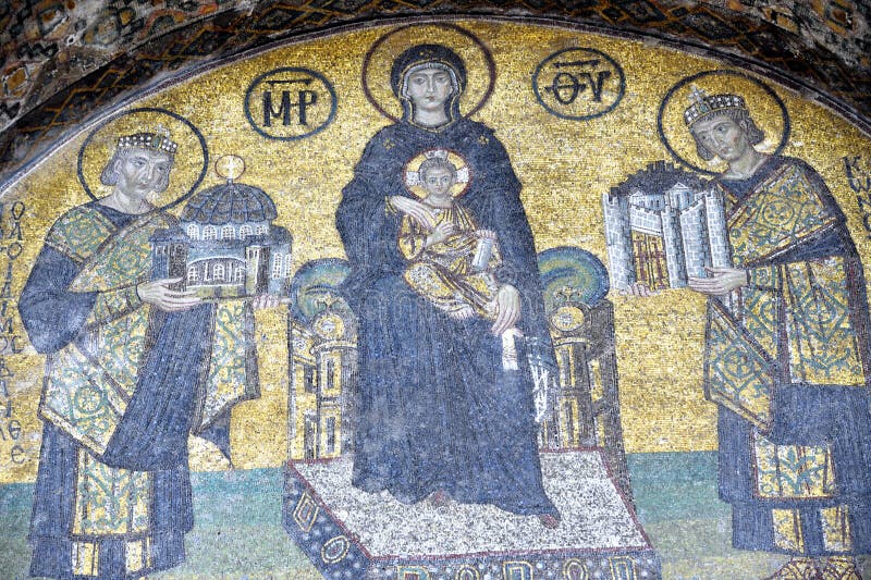 The Comnenus mosaics, equally located on the eastern wall of the southern gallery, date from 1122. The Virgin Mary is standing in the middle, depicted, as usual in Byzantine art, in a dark blue gown. She holds the Child Christ on her lap (wikipedia). The Comnenus mosaics, equally located on the eastern wall of the southern gallery, date from 1122. The Virgin Mary is standing in the middle, depicted, as usual in Byzantine art, in a dark blue gown. She holds the Child Christ on her lap (wikipedia).