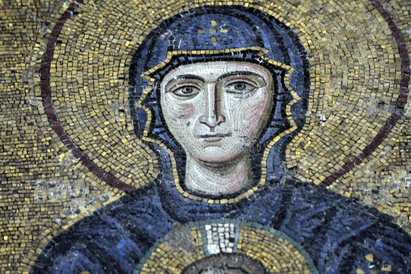 The Comnenus mosaics, equally located on the eastern wall of the southern gallery, date from 1122. The Virgin Mary is standing in the middle, depicted, as usual in Byzantine art, in a dark blue gown. She holds the Child Christ on her lap (wikipedia). The Comnenus mosaics, equally located on the eastern wall of the southern gallery, date from 1122. The Virgin Mary is standing in the middle, depicted, as usual in Byzantine art, in a dark blue gown. She holds the Child Christ on her lap (wikipedia).