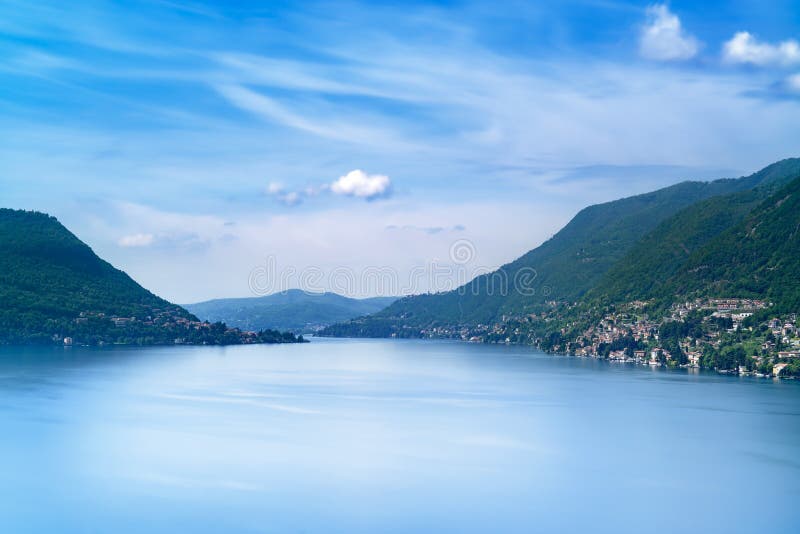 Como Lake landscape. Cernobbio village, trees, water and mountains. Italy
