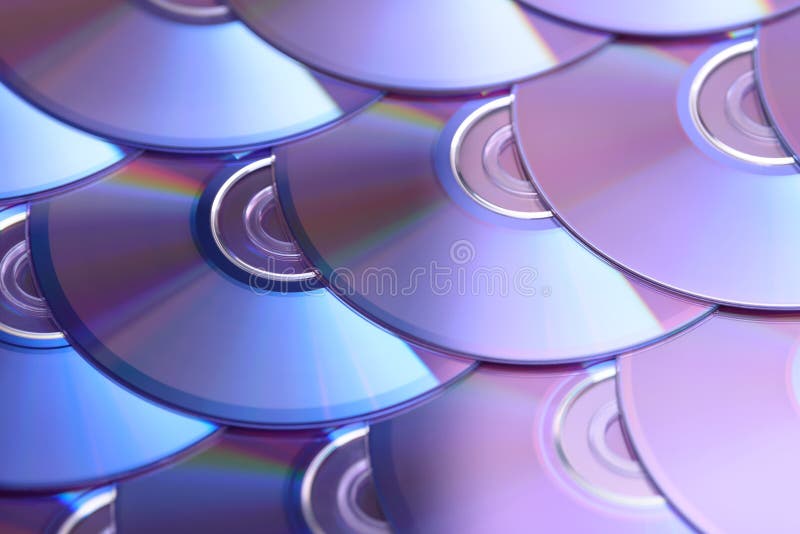 Compact discs background. Several cd dvd blu-ray discs. Optical recordable or rewritable digital data storage. royalty free stock photos