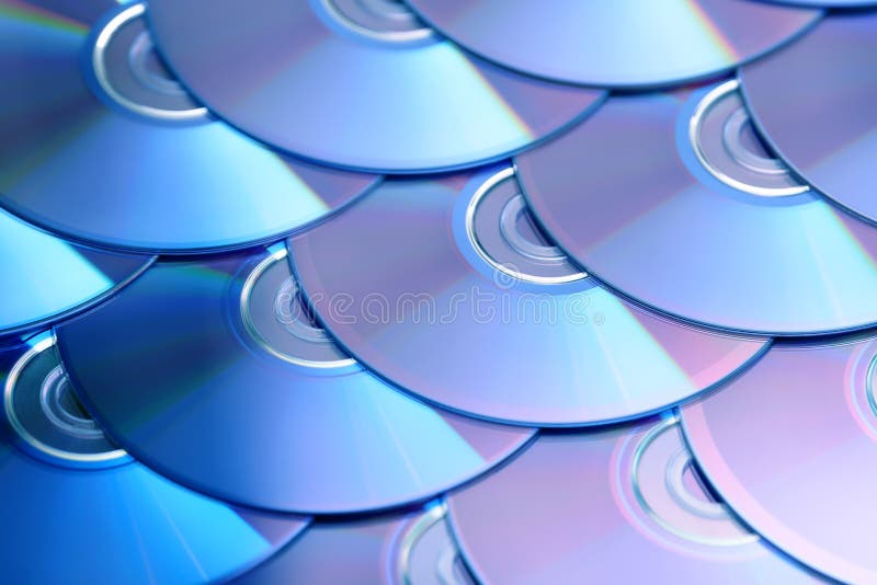 Compact discs background. Several cd dvd blu-ray discs. Optical recordable or rewritable digital data storage. royalty free stock photo