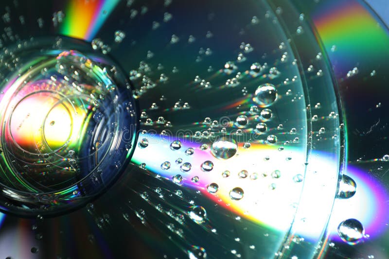 Compact discs with drops as background, closeup royalty free stock photos