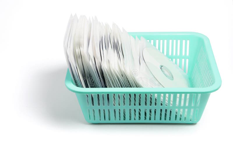Compact Discs in Plastic Basket royalty free stock photography