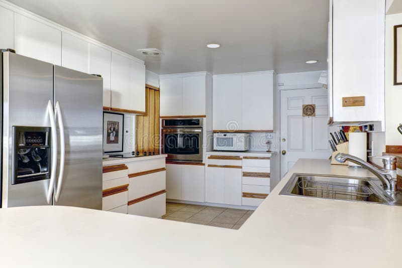 Compact kitchen room with white cabinetry royalty free stock images Compact kitchen room with white cabinetry royalty free stock images