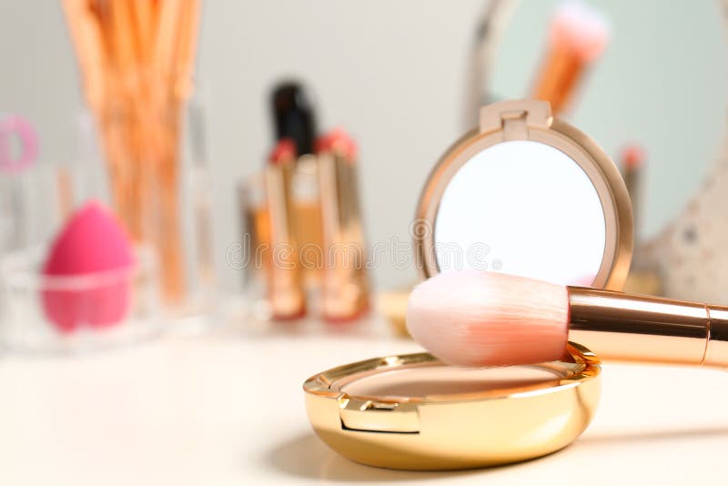 Compact Powder and Makeup Brush on Dressing Table. Space for Stock