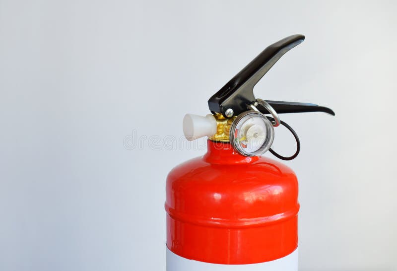 Compact Red Fire Extinguisher for Auto or Home on White Background. for Fire Emergencies. Stock
