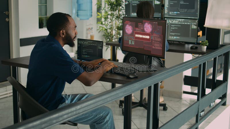 Company developer writing code encounters system failure, parsing algorithm and having computer hacked. Database coder having unexpected compiling error in software development office.