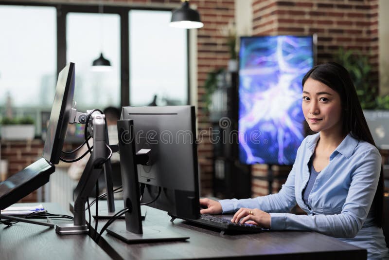 Company office confident professional worker sitting in workspace using computer stock photos