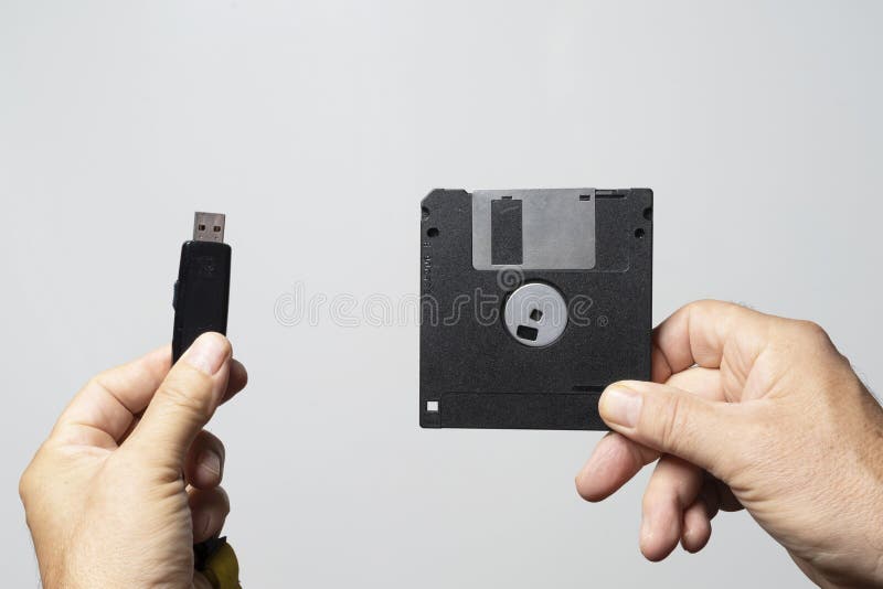 A Floppy Disk and a USB Key Stock Image of computer, background: