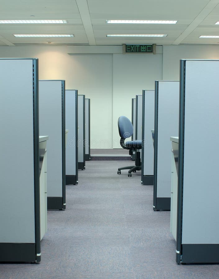 An empty chair at end of a row of cubicle. An empty chair at end of a row of cubicle