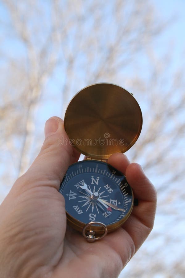 Compass pointing east stock image. Image of survive, brass 4392901