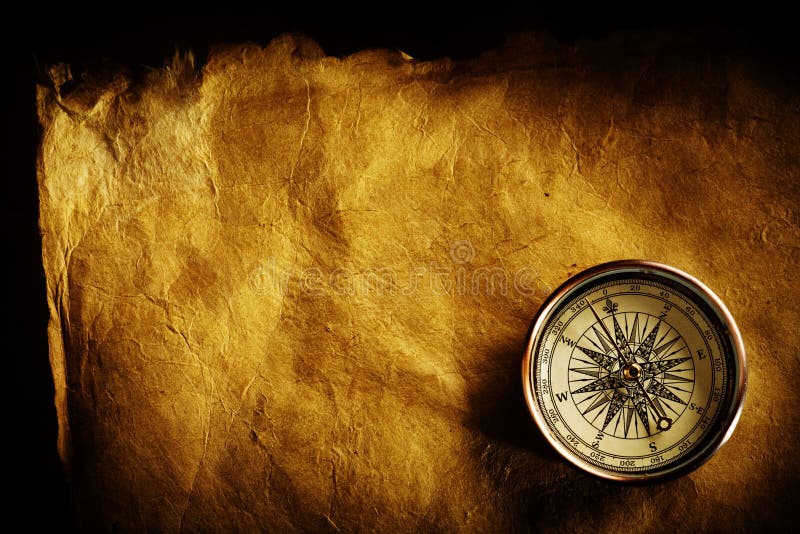 Close up view of the Compass on the old paper background