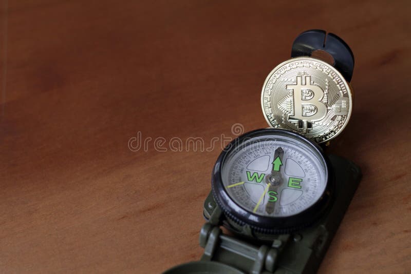 Compass e Bitcoin - trovare la strada immagine stock