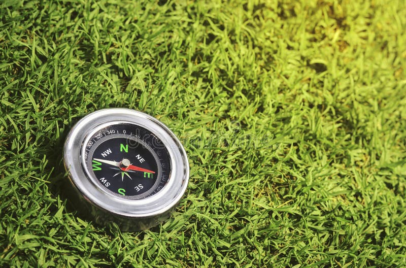 Compass With Green Arrow Leading To A Sustainable Future Stock Photo