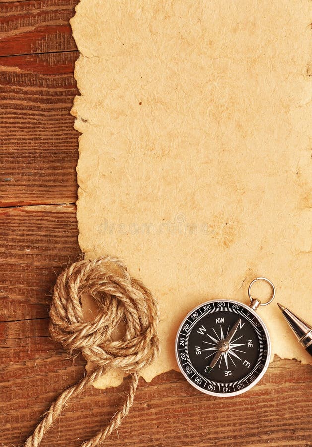 Compass and rope on grunge background