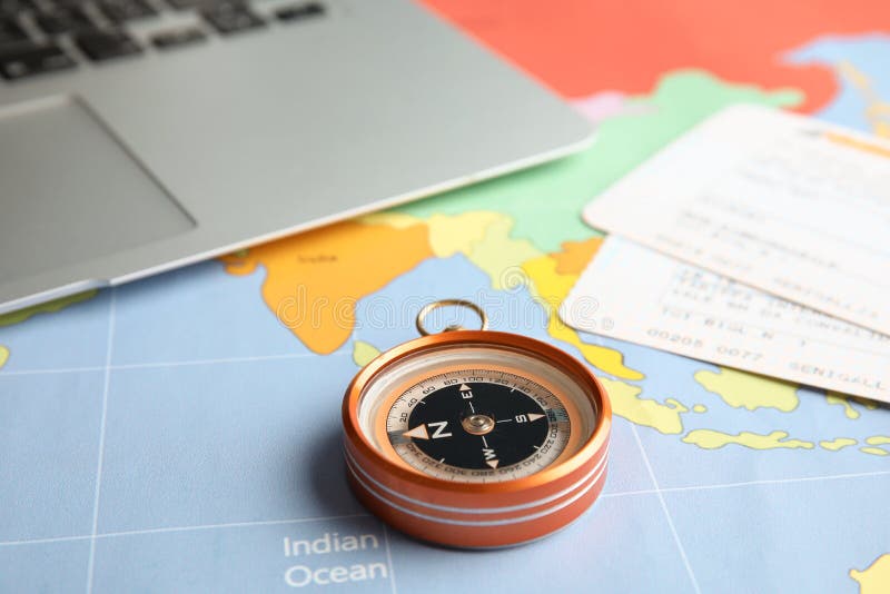 Compass, tickets and laptop on world map royalty free stock image Compass, tickets and laptop on world map royalty free stock image