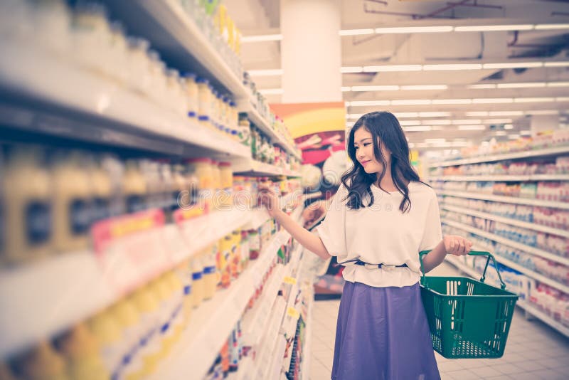 Lovely young woman shopping at the supermarket. Lovely young woman shopping at the supermarket