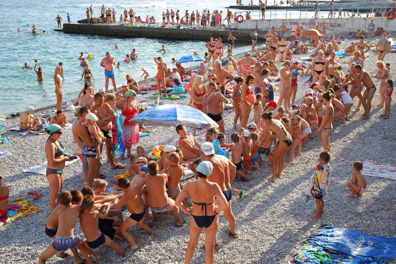 YALTA - AUG 20: Competition in tug of war between the children on the beach on August 20, 2013 in Yalta, Ukraine. YALTA - AUG 20: Competition in tug of war between the children on the beach on August 20, 2013 in Yalta, Ukraine.