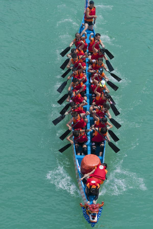 A view of a team paddling to win the race dragon boat races are held on the rivers and lakes.dragon boat race has become an international sports event, with teams from around the world coming to Taiwan for the races every year. It is an event of intense excitement, with the colorfully decorated dragon boats, the cheering of the crowd, and the wild beating of the drums to spur the rowers on. A view of a team paddling to win the race dragon boat races are held on the rivers and lakes.dragon boat race has become an international sports event, with teams from around the world coming to Taiwan for the races every year. It is an event of intense excitement, with the colorfully decorated dragon boats, the cheering of the crowd, and the wild beating of the drums to spur the rowers on.