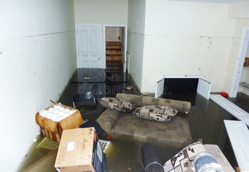 STATEN ISLAND, NY - OCTOBER 30: Completely flooded basement next day after Hurricane Sandy on October 30, 2012 in Staten Island. It is visible line showing maximum water level higher than 7 feet. STATEN ISLAND, NY - OCTOBER 30: Completely flooded basement next day after Hurricane Sandy on October 30, 2012 in Staten Island. It is visible line showing maximum water level higher than 7 feet