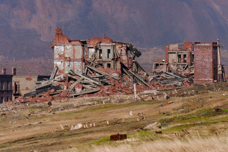 Completely destroyed a two-story brick building. Concrete fragment stock images, royalty-free photos and pictures