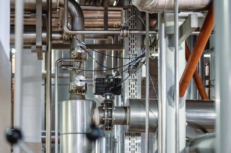 A complex and intricate system of steel pipelines, stainless insulation stock image