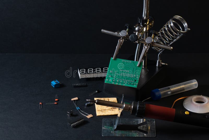 The components of the main board in the process of assembling the finished device for further use. stock photos