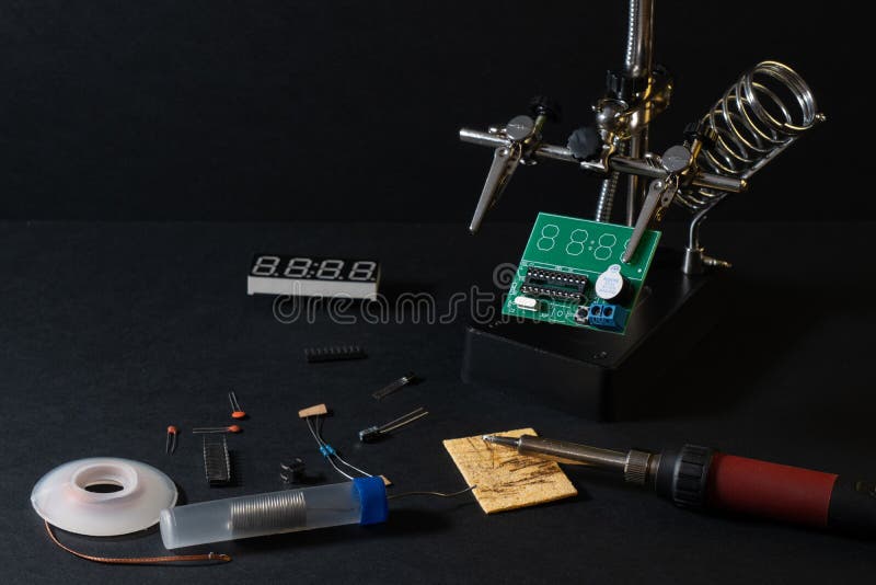 The components of the main board in the process of assembling the finished device for further use. stock images