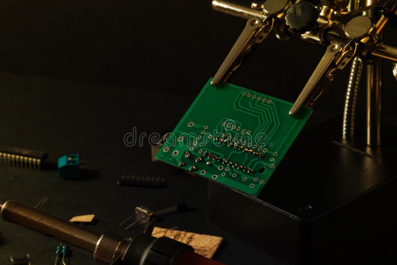 The components of the main board in the process of assembling the finished device for further use. royalty free stock photo