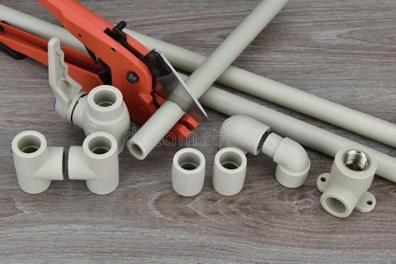 Components Making Water Pipes and Special Scissors for Cutting Pipes. Stock Image Image of