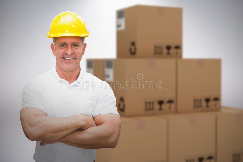 Composite Image of Worker Wearing Hard Hat in Warehouse Stock Photo