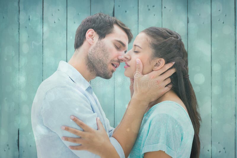 Composite image of attractive young couple about to kiss royalty free stock images Composite image of attractive young couple about to kiss royalty free stock images