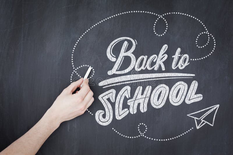 back to school against hand writing with chalk on board. back to school against hand writing with chalk on board