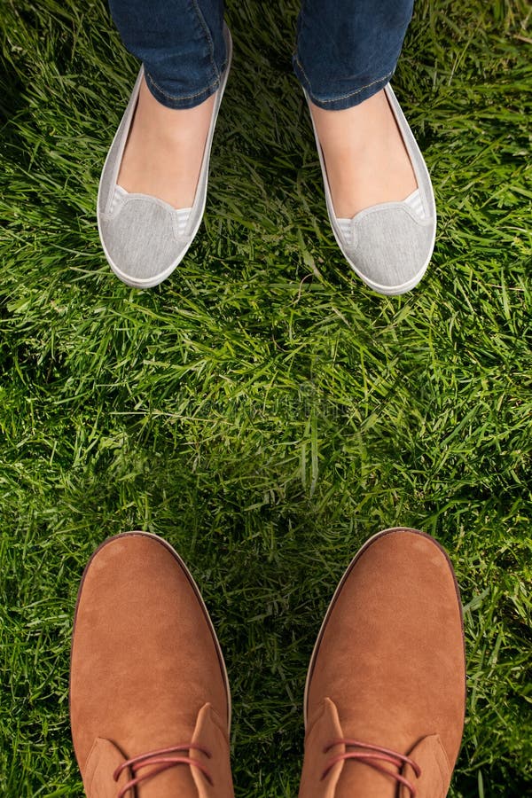 Men Sit Casually in Front of the Laptop while Raising Their Feet on the