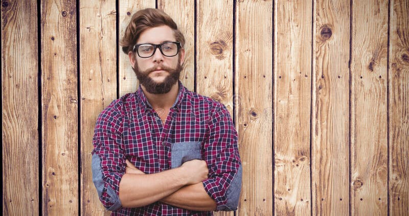 Composite image of confident hipster wearing eye glasses with arms crossed stock photo Composite image of confident hipster wearing eye glasses with arms crossed stock photo