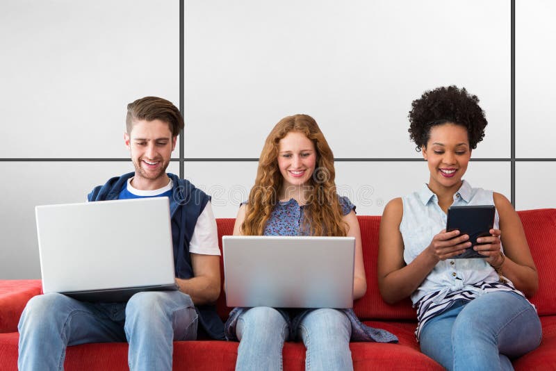 Composite image of creative team using laptops and digital tablet stock images Composite image of creative team using laptops and digital tablet stock images