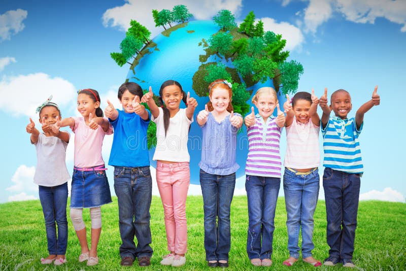 Composite image of cute pupils smiling at camera in classroom stock photography