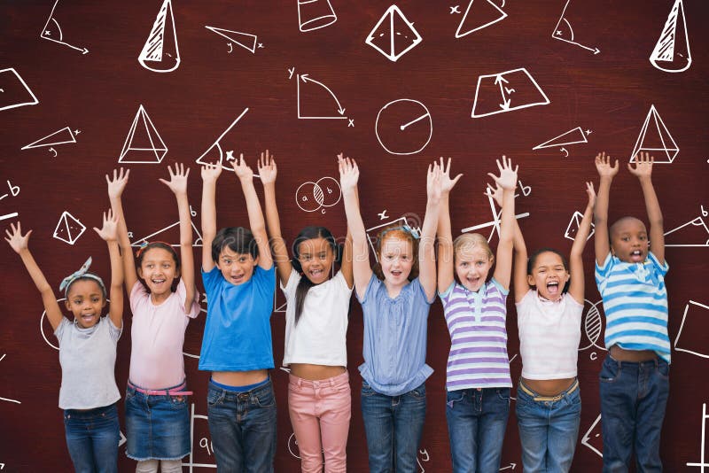Composite image of cute pupils smiling at camera in classroom stock photos
