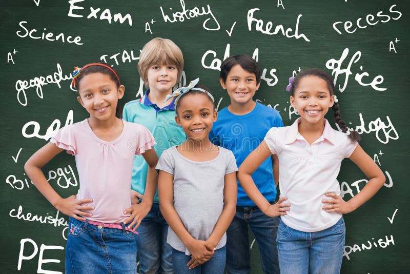 Composite image of cute pupils smiling at camera in classroom royalty free stock image