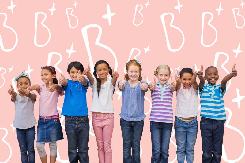 Composite image of cute pupils smiling at camera in classroom stock image