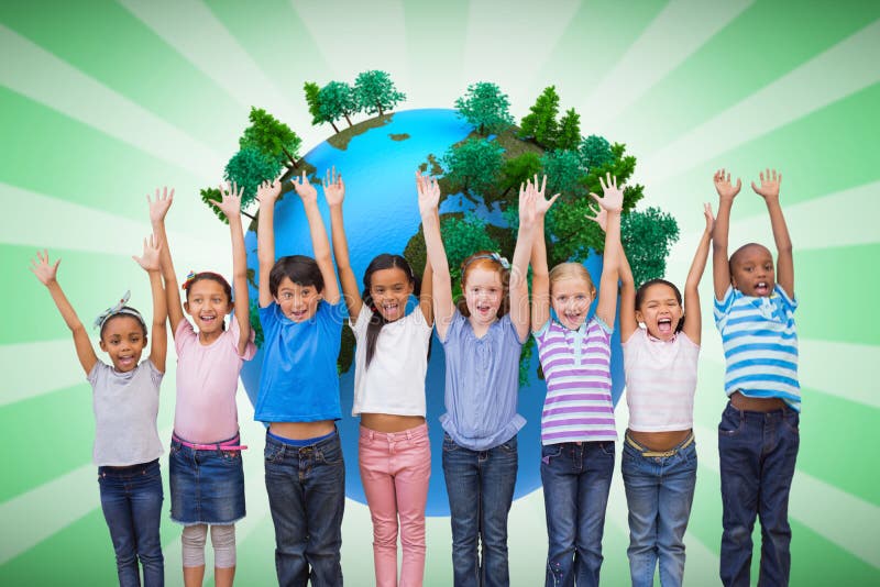 Composite image of cute pupils smiling at camera in classroom royalty free stock photography