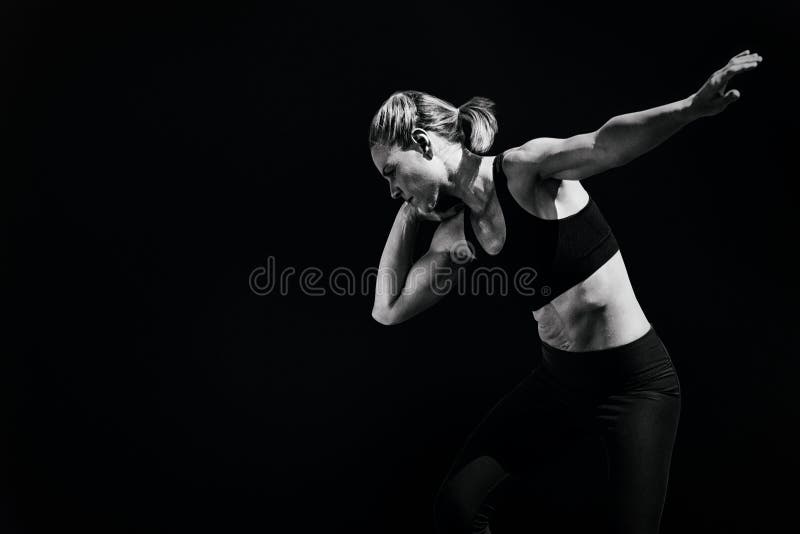 Composite image of front view of sportswoman is practising shot put