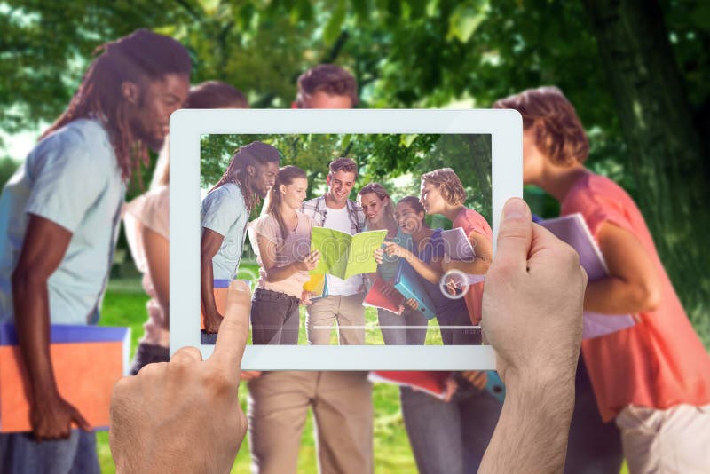 Composite image of hand holding tablet pc royalty free stock photography