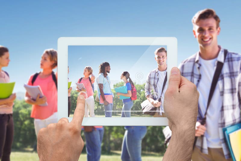 Composite image of hand holding tablet pc stock photos