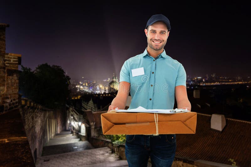 Composite Image of Handsome Courier Man with Parcel Stock Image Image