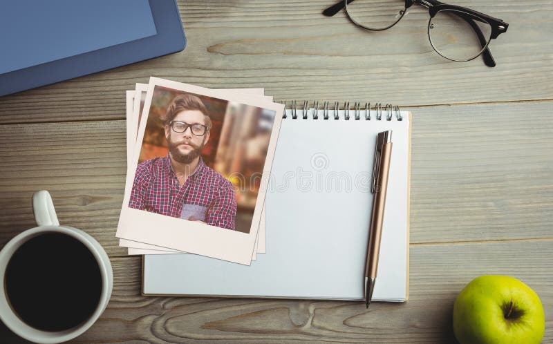 Composite image of happy hipster against wooden fence.