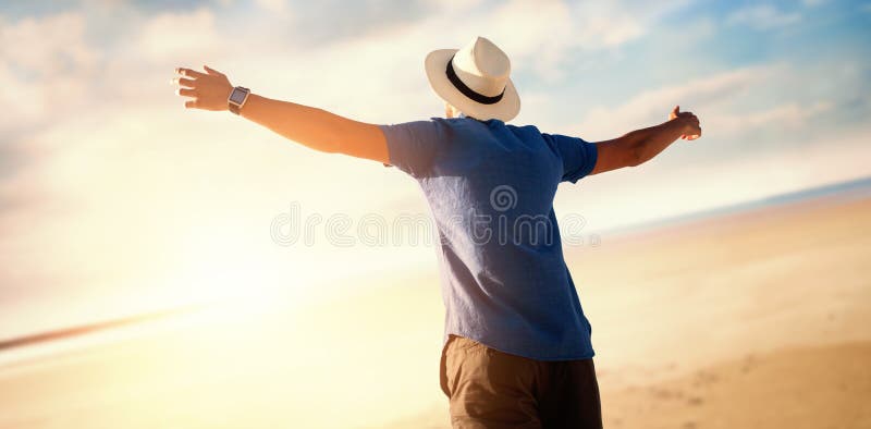 Composite image of low angle of a man raising arms up